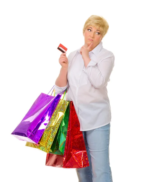 Mujer mayor feliz con bolsas y tarjeta de crédito —  Fotos de Stock