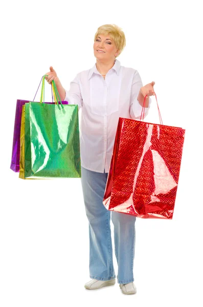 Happy senior woman with bags — Stock Photo, Image