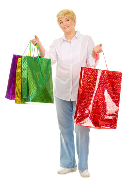 Happy senior woman with bags