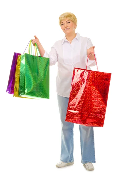 Happy senior woman with bags — Stock Photo, Image