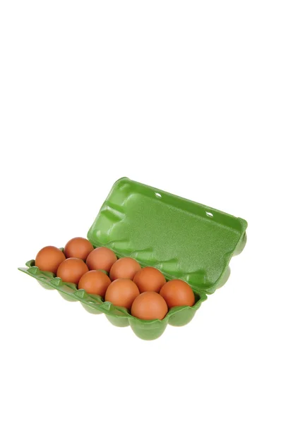 Eggs in the green basket isolated on the white background. — Stock Photo, Image
