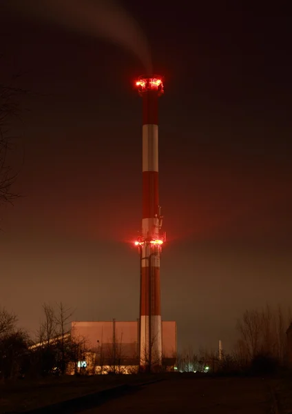 Illuminated chimney at night — Stock Photo, Image