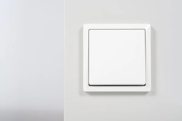 Duvarda beyaz ışık düğmesi — Stok fotoğraf
