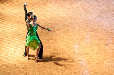 Competitors dancing latin dances at the dancing conquest clipart