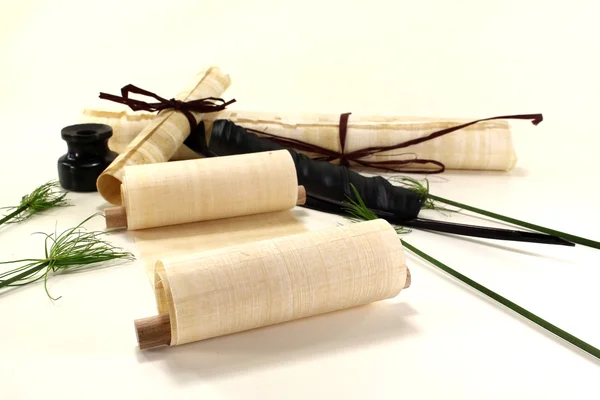 stock image Papyrus rolls with inkwell and pen