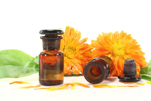Marigold tincture with flowers — Stock Photo, Image