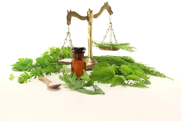 Homeopathy with apothecary scale — Stock Photo, Image