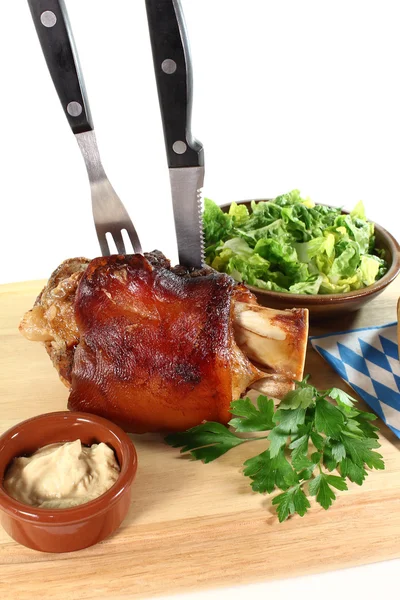 Knuckle of pork with cutlery — Stock Photo, Image