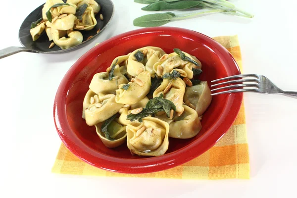 Cooked tortellini with sage butter — Stock Photo, Image