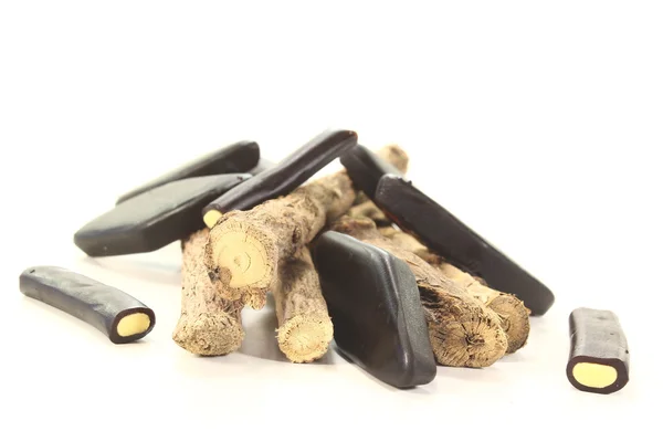 Licorice root with liqorice — Stock Photo, Image