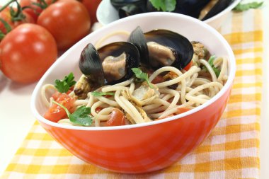 Spaghetti with mussels and parsley clipart