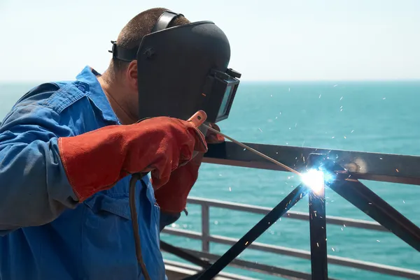 Welder working with metal construction — Stock Photo, Image