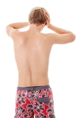 A young man grasping his head where the pain is clipart