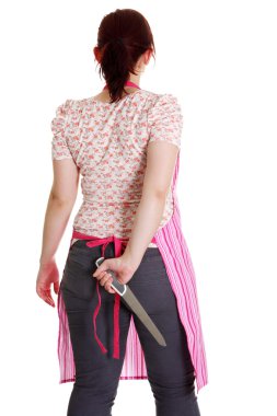 Housewife in pink apron with knife behind her back . clipart