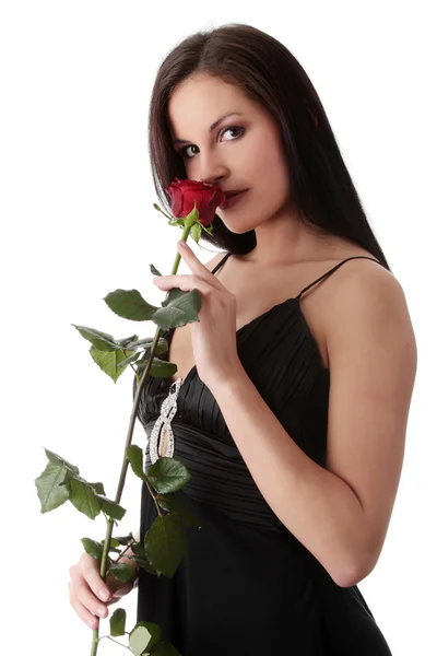 stock image Beautiful woman in sexy dress holding red rose