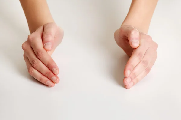 Female hands in protection shape — Stock Photo, Image