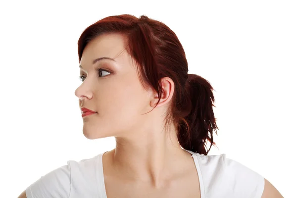 Portrait of a young woman looking left — Stock Photo, Image