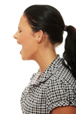 Furiouse young woman screaming. clipart