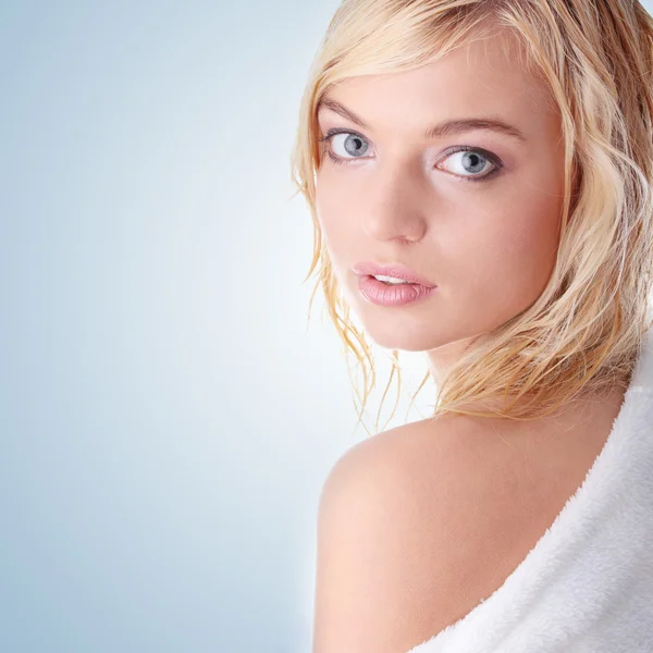 Young woman dressed in white bathrobe — Stock Photo, Image