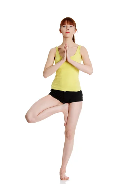 Young woman doing yoga — Stock Photo, Image
