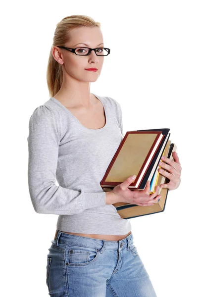 Jovem caucasiana (estudante) com livros — Fotografia de Stock