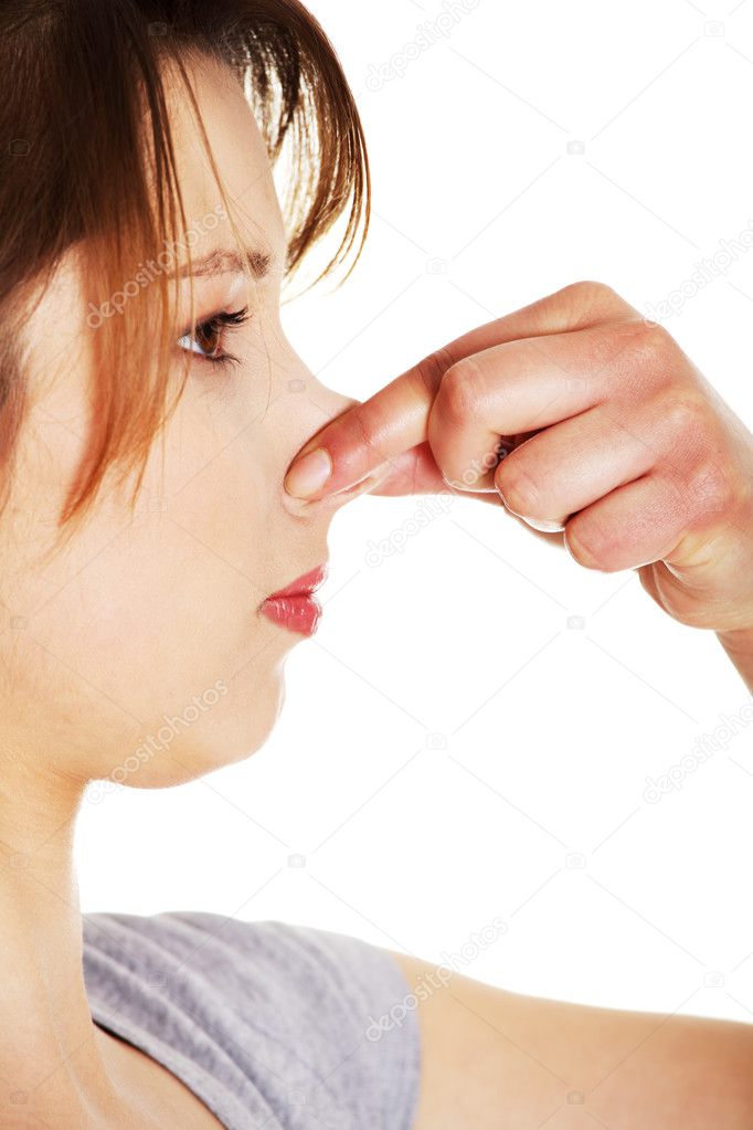 Young woman covering her nose