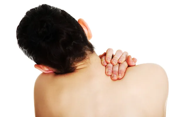 Jonge vrouw met pijn in haar rug — Stockfoto