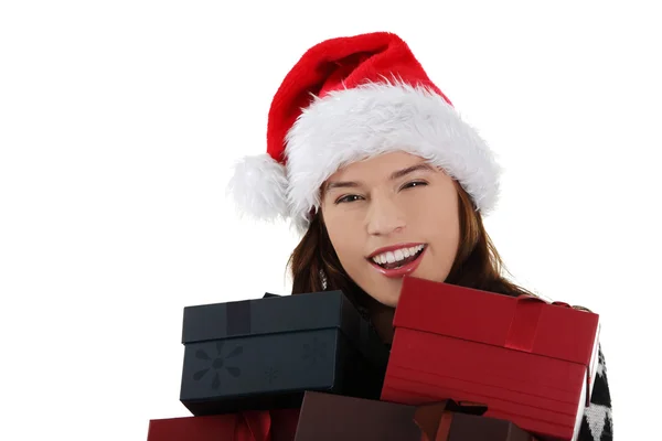 Vrouw in Kerstman hoed, bedrijf Kerstmis vakken, — Stockfoto