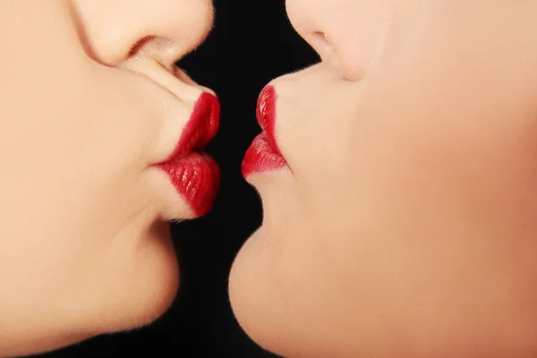 Closeup of pair women mouths kissing — Stock Photo, Image