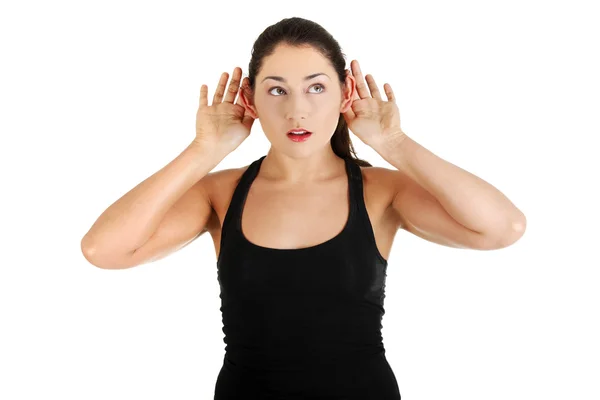 Έκπληκτη γυναίκα προσπαθεί να ακούσει ένα κουτσομπολιό — Φωτογραφία Αρχείου