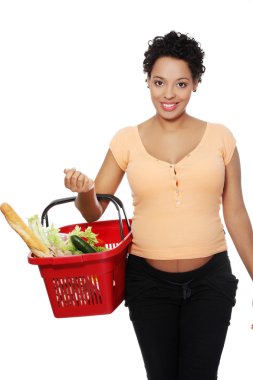 Pregnant woman on shopping. clipart