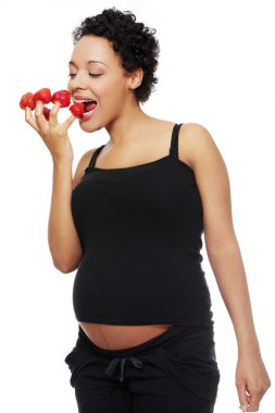 Pregnant woman eating healthy food. clipart