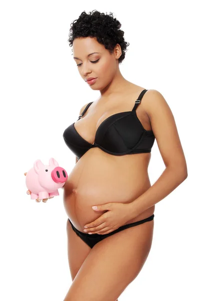 Mulher grávida vestida de lingerie preta . — Fotografia de Stock
