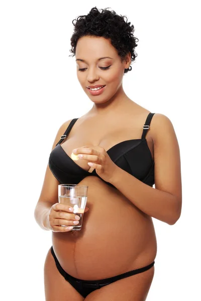 Piacevole donna incinta vestita in lingerie nera . — Foto Stock