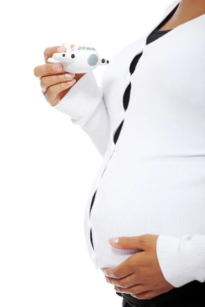 Kobieta w ciąży z samolotu zabawka. — Zdjęcie stockowe
