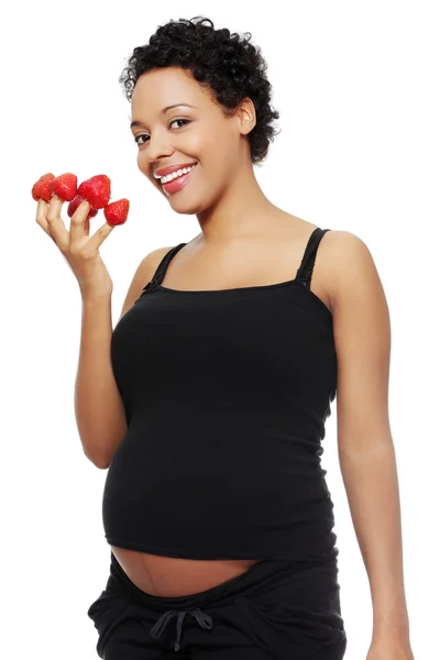 Mujer embarazada comiendo alimentos saludables . — Foto de Stock