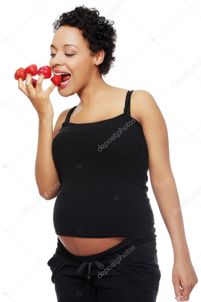 Pregnant woman eating healthy food.