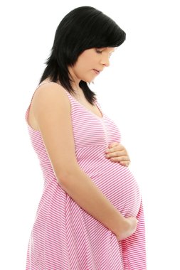 Pregnant woman portrait holding her belly clipart