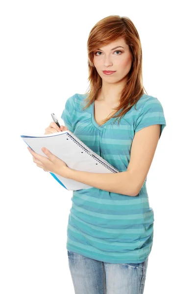Adolescent étudiant fille avec notepad — Photo
