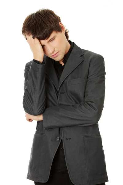 Young businessman with a big headache or problem — Stock Photo, Image