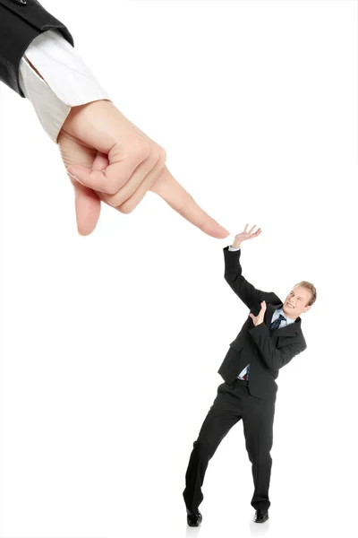 Scared young businessman afraid of big hand — Stock Photo, Image