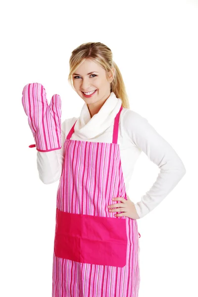 Young housewife in pink apron — Stock Photo, Image