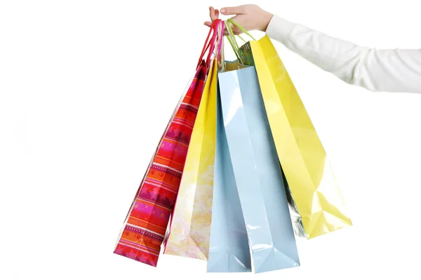 Ženská ruka drží barevné nákupní tašky — Stock fotografie