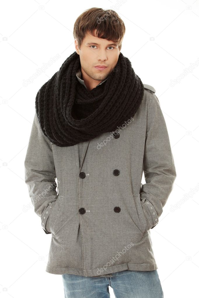 Portrait of handsome man in scarf and coat.