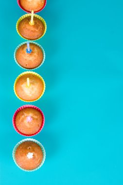 Festive cupcakes with a candles clipart