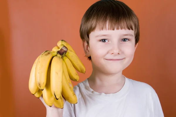 Retrato niño sonriente con plátanos —  Fotos de Stock