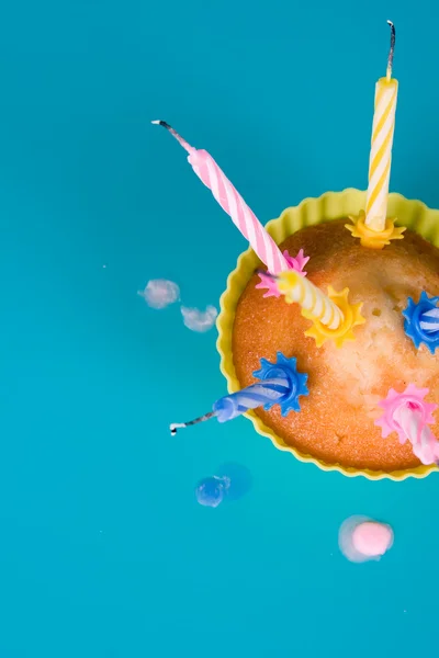 Festive cupcake with a blow out candles — Stock Photo, Image