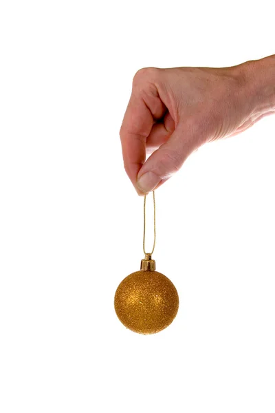 Christmas ball and hand — Stock Photo, Image