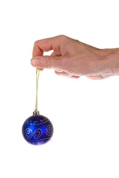 Christmas ball and hand — Stock Photo, Image