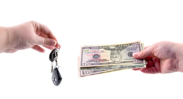 Hand with money and car keys on a white background — Stock Photo, Image